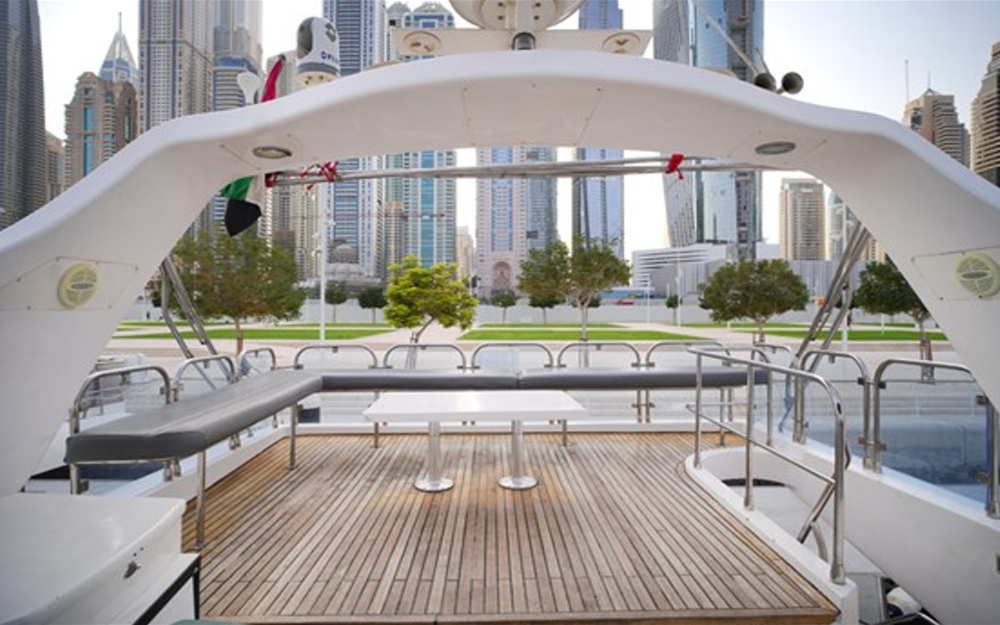 Upper deck seating and wooden flooring on 75 FT Mayyas yacht