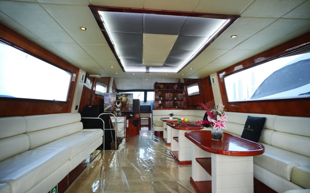 Spacious lounge with white leather sofas inside 75 FT Mayyas yacht