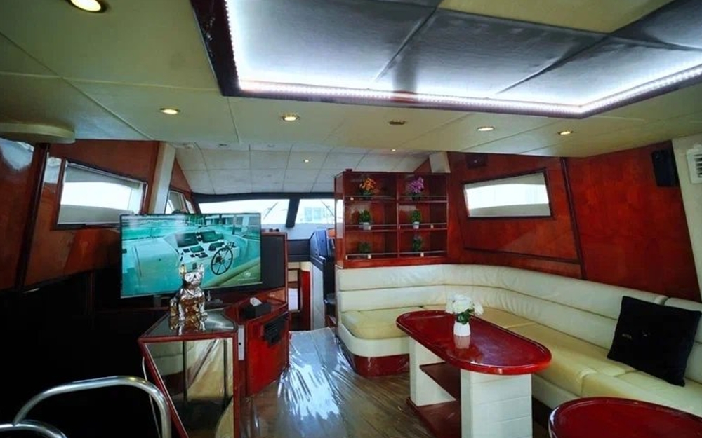 Spacious lounge with LED ceiling lights and sofa seating inside Mayyas yacht