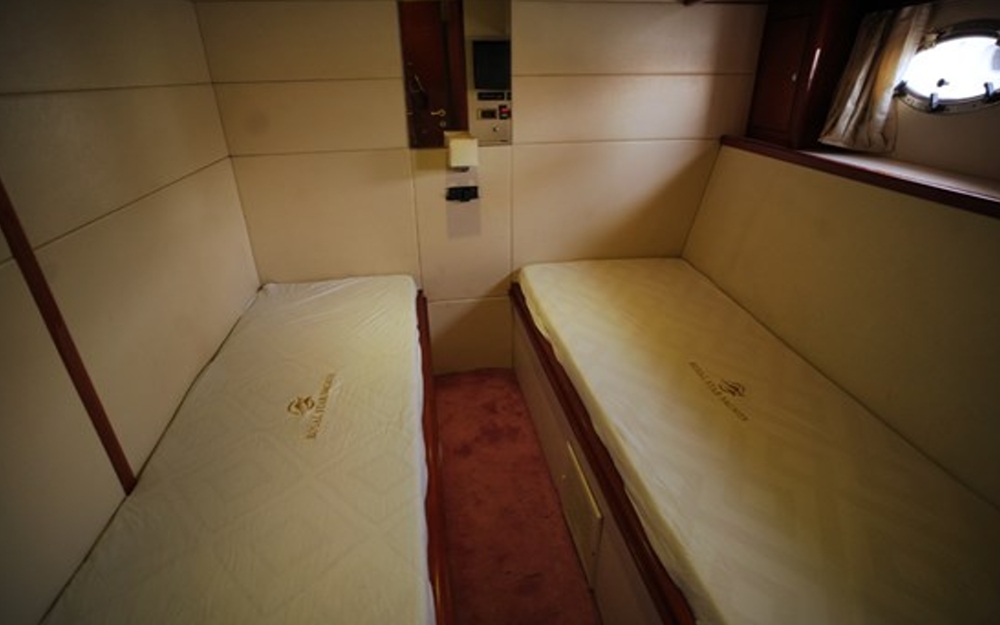 Twin cabin bedroom with two single beds inside 75 FT Mayyas yacht
