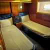 Twin bedroom cabin with wooden interior on 90 FT Big Daddy yacht