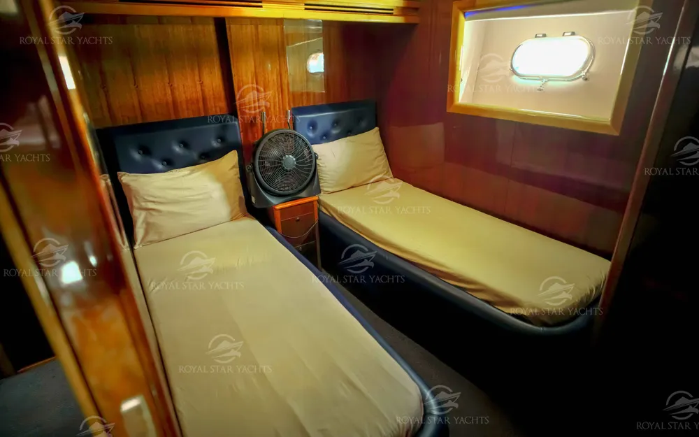 Twin bedroom cabin with wooden interior on 90 FT Big Daddy yacht