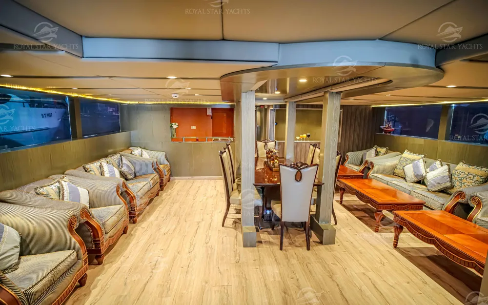 Spacious yacht interior with dining and lounge area