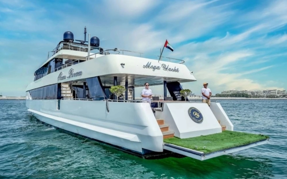 Luxury mega yacht rear view with crew