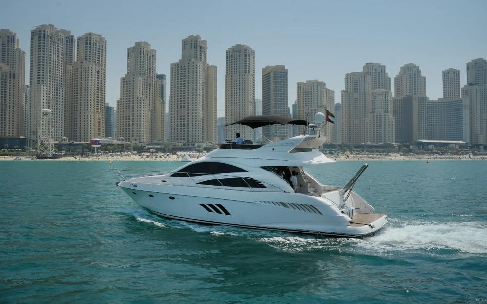 Rear side view of 55 FT Integrity yacht in front of Dubai high-rises