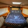Bedroom with luxury bedding inside 59 FT Majesty yacht