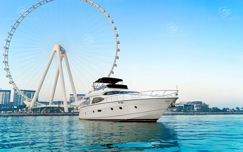68 FT Luna yacht cruising near Ain Dubai wheel.