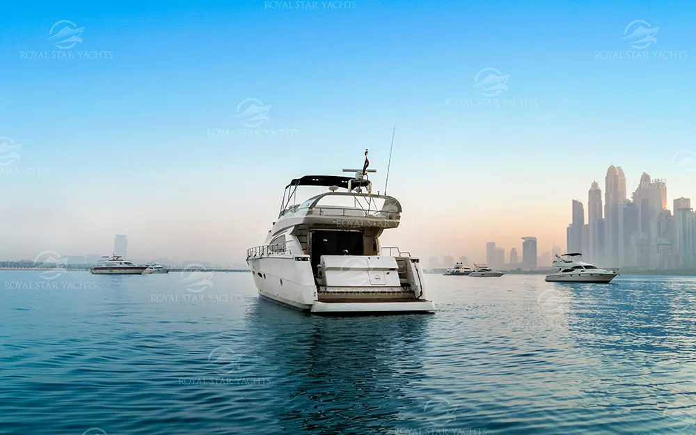 68 FT Luna yacht sailing near Dubai Marina skyline.